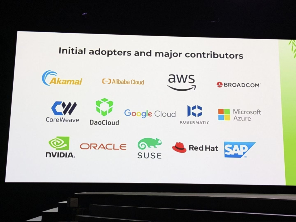 (slide) Initial adopters and major contributors: Akamai (logo), Alibaba Cloud (logo), AWS (logo), Broadcom (logo), CoreWeave (logo), DaoCloud (logo), Google Cloud (logo), Kubermatic (logo), Microsoft Azure (logo), NVIDIA (logo), Oracle (logo), SUSE (logo), Red Hat (logo), SAP (logo)